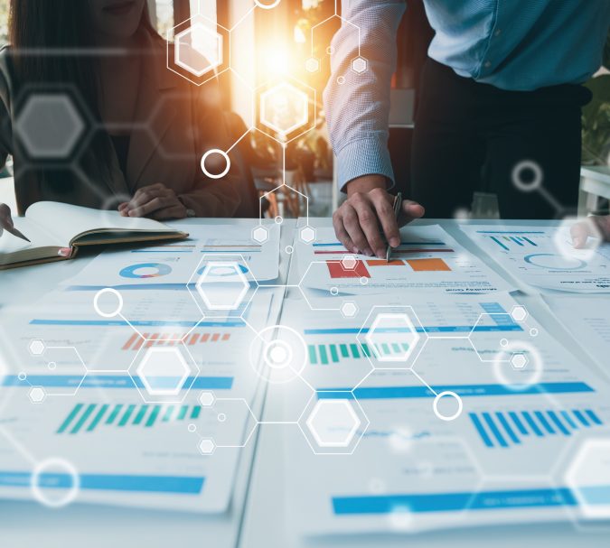 Administration or Accountant discussing with partner are meeting to audit finance planning sales to meet targets set in next year. Finance concept