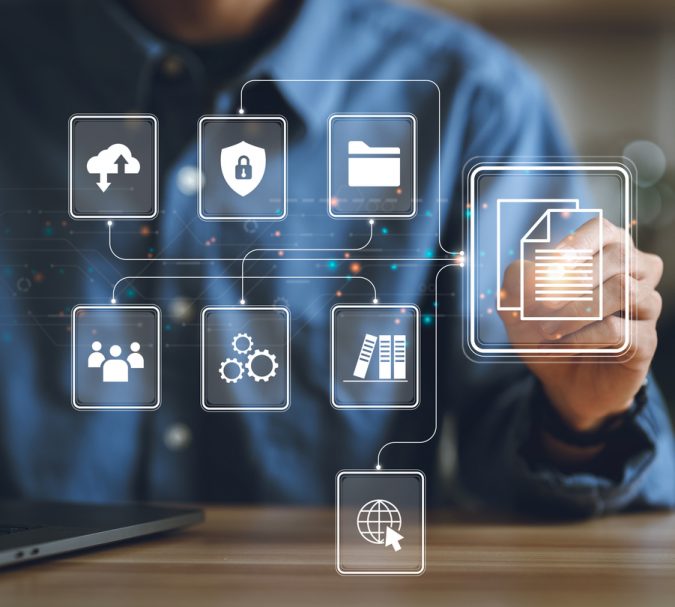 Businessman using a computer to document management concept, online documentation database and digital file storage system or software, records keeping, database technology, file access, doc sharing.