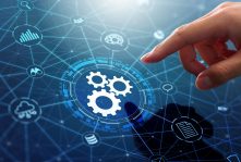 Businessman touching gears icon on network connection.